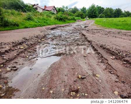 Soil erosion on a rural road after heavy rainstorm 141206474