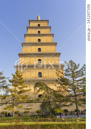 Xi'an, China - Dec 31, 2024 : View of Big Wild Goose Pagoda against blue sky in Xian, China on Dec 31, 2024. Xi'an, China - Dec 31, 2024 : View of Big Wild Goose Pagoda against blue sky in Xian, China on Dec 31, 2024. 141207109