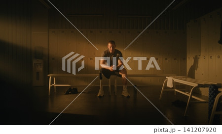 Resilient Male Athlete with Leg Prosthesis Ready to Start Gym Workout Resilient Male Athlete with Leg Prosthesis Ready to Start Gym Workout 141207920