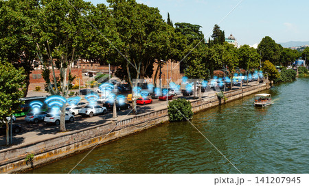 Surveillance technology used in urban area with cars near water and trees Surveillance technology used in urban area with cars near water and trees 141207945