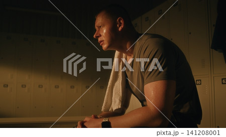 Exhausted Amputee Athlete Drinking Water and Recovering After Workout Exhausted Amputee Athlete Drinking Water and Recovering After Workout 141208001
