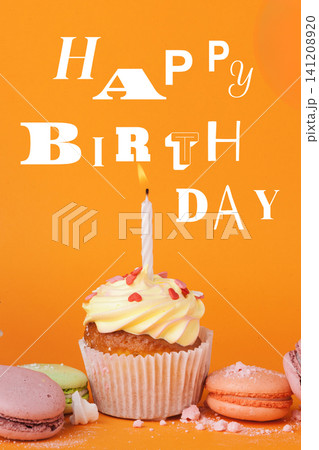 Happy birthday celebration with cake and macarons on a bright orange table Happy birthday celebration with cake and macarons on a bright orange table 141208920