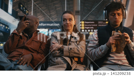 Neurodivergent Woman Experiencing Sensory Overload at Busy Airport Gate 141209238