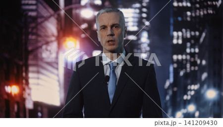 Professional Mature Male Reporter Delivering Urgent News Broadcast on Busy Night City Street Professional Mature Male Reporter Delivering Urgent News Broadcast on Busy Night City Street 141209430