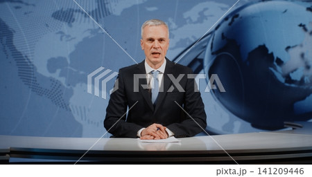 Professional Mature Male News Anchor Finalizing Daily Digest Professional Mature Male News Anchor Finalizing Daily Digest 141209446