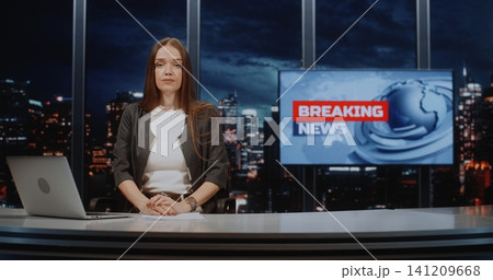 Professional Female News Anchor Presenting Breaking News in Modern Digital Television Studio Professional Female News Anchor Presenting Breaking News in Modern Digital Television Studio 141209668