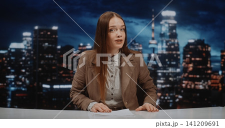 News Host Presents Daily Headlines From modern Television Set 141209691