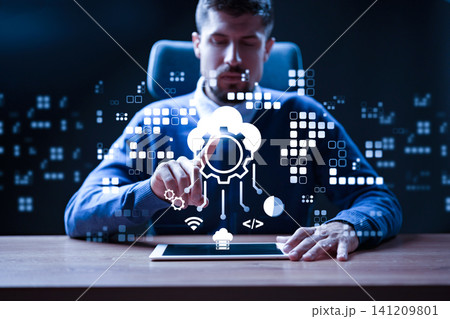 Business professional interacts with software on tablet in modern office setting 141209801