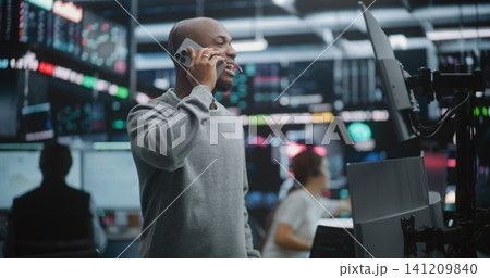 Happy African American Financial Expert Sharing Good News of Portfolio Growth Happy African American Financial Expert Sharing Good News of Portfolio Growth 141209840