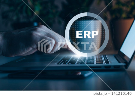 Working on ERP software using a laptop at home during evening hours Working on ERP software using a laptop at home during evening hours 141210140