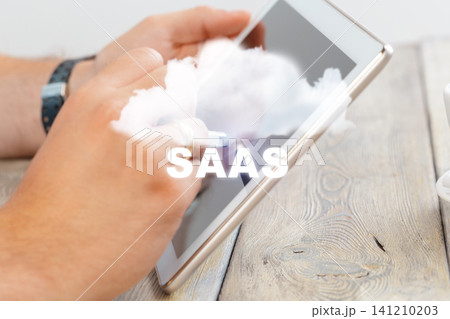 Using tablet for SaaS business solution in modern workspace setting 141210203