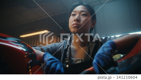 In Garage, Young Mechanic Pauses Beside Motorcycle, Thinking Intensely About How Fix Malfunction In Garage, Young Mechanic Pauses Beside Motorcycle, Thinking Intensely About How Fix Malfunction 141210604