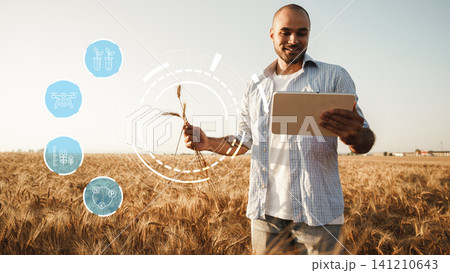 Modern technology supports farmers in smart agriculture practices in a wheat field Modern technology supports farmers in smart agriculture practices in a wheat field 141210643