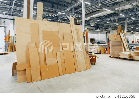 Furniture workshop with stacked materials and tools for woodworking projects Furniture workshop with stacked materials and tools for woodworking projects 141210659