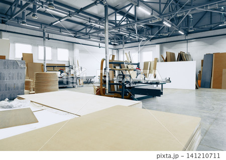 Furniture workshop space with tools and materials at work Furniture workshop space with tools and materials at work 141210711