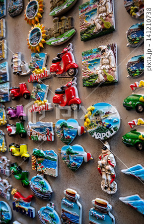 Naples, italy. December 28, 2024. Assortment of colorful souvenir magnets from napoli, italy, including vespas, pulcinella figures, and scenic views Naples, italy. December 28, 2024. Assortment of colorful souvenir magnets from napoli, italy, including vespas, pulcinella figures, and scenic views 141210738