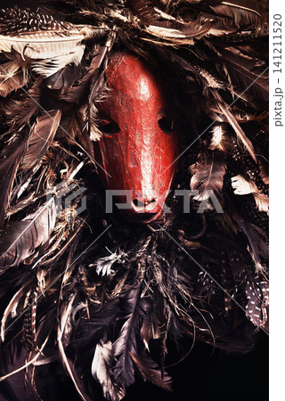 Halloween, monster and festival skeleton with creative costume for unique dark horror animal skull in studio. Scary, traditional and surreal goat face mask with feathers for culture for sinister art Halloween, monster and festival skeleton with creative costume for unique dark horror animal skull in studio. Scary, traditional and surreal goat face mask with feathers for culture for sinister art 141211520