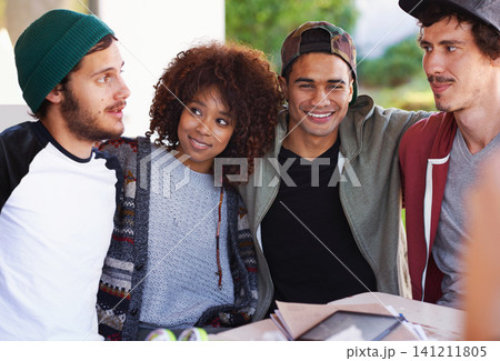 Smile, table and university friends at study group with notes, hug and social support in education. Books, tablet and happy students relax together on patio with diversity, opportunity and college Smile, table and university friends at study group with notes, hug and social support in education. Books, tablet and happy students relax together on patio with diversity, opportunity and college 141211805