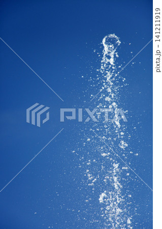 Water splashing from the fountain in the background of blue sky Water splashing from the fountain in the background of blue sky 141211919