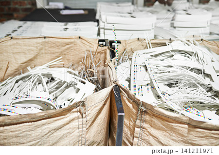 Bag, paper and recycle in factory for printing, product and industry for manufacturing and distribution. Cardboard waste and stock for production process, assembly line and supply chain in warehouse Bag, paper and recycle in factory for printing, product and industry for manufacturing and distribution. Cardboard waste and stock for production process, assembly line and supply chain in warehouse 141211971