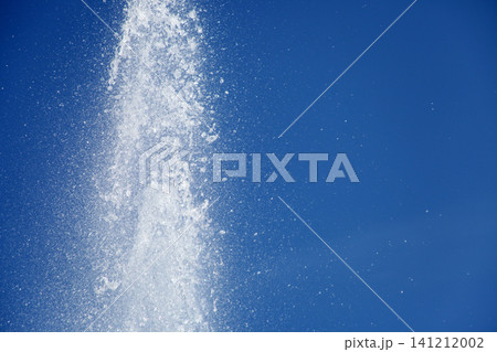 Water splashing from the fountain in the background of blue sky Water splashing from the fountain in the background of blue sky 141212002