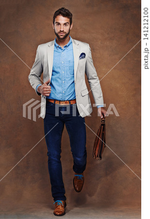 Travel, bag and portrait of man with fashion in studio, background and mockup for business vacation. Formal, style and luxury luggage for airport, journey to Italy and walk in leather shoes with suit 141212100