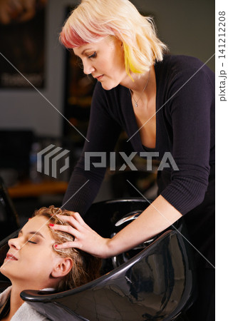 Massage, washing and woman at basin with hairdresser for professional haircare, cleaning or luxury treatment. Grooming, hair care and client at salon basin with soap, relax and small business service Massage, washing and woman at basin with hairdresser for professional haircare, cleaning or luxury treatment. Grooming, hair care and client at salon basin with soap, relax and small business service 141212208