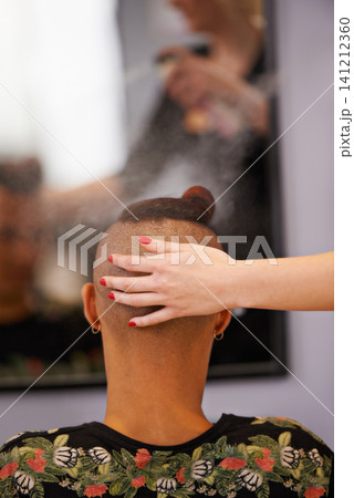 Female hairdresser, mirror and client at barber shop for styling, grooming and professional hair treatment. Male customer, haircut and hairspray in salon chair for makeover and luxury haircare. Female hairdresser, mirror and client at barber shop for styling, grooming and professional hair treatment. Male customer, haircut and hairspray in salon chair for makeover and luxury haircare. 141212360