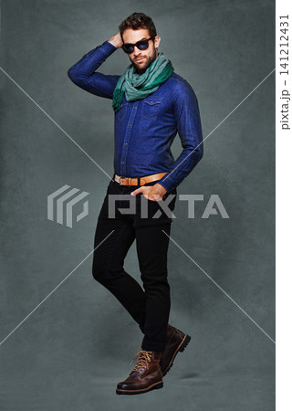 Fashion, eyewear and studio for male person, stylish and formal clothing isolated on background. Confidence, serious and denim with scarf for man model, pose and casual or trendy contemporary outfit Fashion, eyewear and studio for male person, stylish and formal clothing isolated on background. Confidence, serious and denim with scarf for man model, pose and casual or trendy contemporary outfit 141212431