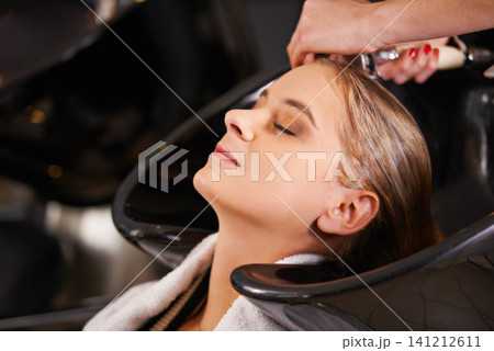 Water, washing and woman at basin with hairdresser for professional haircare, cleaning or luxury treatment. Grooming, hair care and client at salon for rinse, shampoo and small business with service Water, washing and woman at basin with hairdresser for professional haircare, cleaning or luxury treatment. Grooming, hair care and client at salon for rinse, shampoo and small business with service 141212611