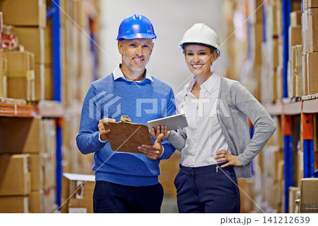 Portrait, warehouse or man with woman, tablet or documents with shipping or industry. Clipboard, inventory or manufacturing with teamwork or boxes with stock or logistics with storage or supply chain Portrait, warehouse or man with woman, tablet or documents with shipping or industry. Clipboard, inventory or manufacturing with teamwork or boxes with stock or logistics with storage or supply chain 141212639