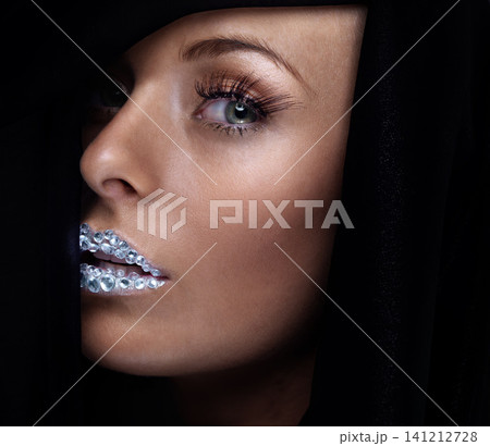 Beauty, portrait and woman with crystal on lips in studio with jewelry on skin isolated on a black background. Diamond, face and serious model with creative makeup for fashion, cosmetics or eyelashes Beauty, portrait and woman with crystal on lips in studio with jewelry on skin isolated on a black background. Diamond, face and serious model with creative makeup for fashion, cosmetics or eyelashes 141212728