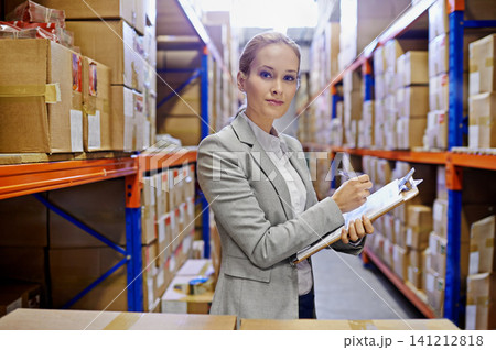 Portrait, clipboard or business woman at a warehouse for logistics, planning or inventory. Face, factory or employee with cargo, checklist or stock storage compliance documents for quality assurance Portrait, clipboard or business woman at a warehouse for logistics, planning or inventory. Face, factory or employee with cargo, checklist or stock storage compliance documents for quality assurance 141212818