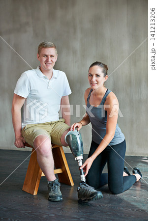 Portrait, woman or patient with disability in artificial leg for medical, fitting or physio training. Man, prosthesis or female therapist in professional, support or care in fitness center session Portrait, woman or patient with disability in artificial leg for medical, fitting or physio training. Man, prosthesis or female therapist in professional, support or care in fitness center session 141213206