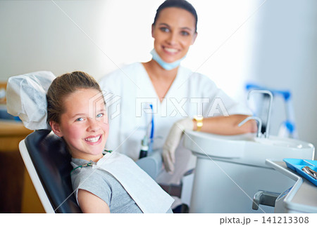 Happy, dentist and portrait of child in chair for cleaning, teeth whitening and wellness. Healthcare, dentistry and woman and girl with tools for dental hygiene, oral care and medical consultation 141213308