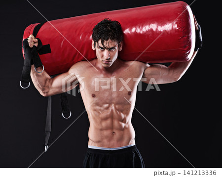 Portrait, punching bag and man with training, boxing and fitness on a dark studio background. Face, person and model with challenge and endurance with progress and wellness with health and strength Portrait, punching bag and man with training, boxing and fitness on a dark studio background. Face, person and model with challenge and endurance with progress and wellness with health and strength 141213336