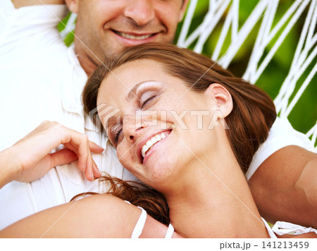 Love, happy couple or relax on hammock in nature, peace or lazy vacation in summer on tropical island. Young man, woman and wellness at tropical resort, sleeping and holiday for honeymoon outdoor Love, happy couple or relax on hammock in nature, peace or lazy vacation in summer on tropical island. Young man, woman and wellness at tropical resort, sleeping and holiday for honeymoon outdoor 141213459