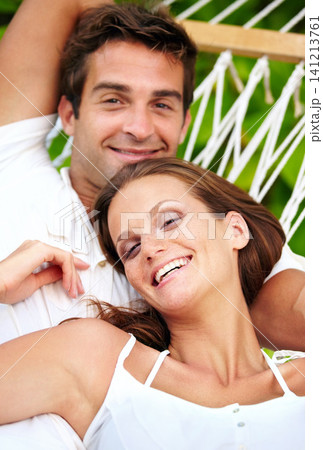 Portrait, happy couple and relax on hammock in nature, love and vacation in summer on tropical island. Young man, woman and face in marriage at beach resort, peace and holiday for leisure outdoor Portrait, happy couple and relax on hammock in nature, love and vacation in summer on tropical island. Young man, woman and face in marriage at beach resort, peace and holiday for leisure outdoor 141213761