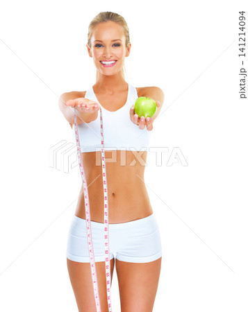 Woman, smile and portrait with apple and measuring tape for detox, diet and fitness on white background. Young person, nutritionist or dietician with fruit for weight loss, health and vitamins Woman, smile and portrait with apple and measuring tape for detox, diet and fitness on white background. Young person, nutritionist or dietician with fruit for weight loss, health and vitamins 141214094