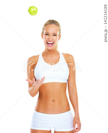 Woman, portrait and apple in studio for diet nutrition on white background, lose weight or training. Female person, smile and fruit snack with mockup space or health benefit as progress, goal or meal Woman, portrait and apple in studio for diet nutrition on white background, lose weight or training. Female person, smile and fruit snack with mockup space or health benefit as progress, goal or meal 141214189