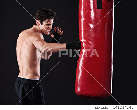 Man, punching bag and boxing with fitness, training and fighter with gloves, cardio and wellness with endurance. Boxer, practice or athlete with exercise or workout with challenge on black background Man, punching bag and boxing with fitness, training and fighter with gloves, cardio and wellness with endurance. Boxer, practice or athlete with exercise or workout with challenge on black background 141214246