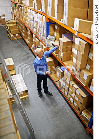 Tablet, boxes or above of man in factory for delivery order, storage or stock in warehouse for website. Printing, mature manager or supply chain inspection for cargo, package or wholesale shipping Tablet, boxes or above of man in factory for delivery order, storage or stock in warehouse for website. Printing, mature manager or supply chain inspection for cargo, package or wholesale shipping 141214264