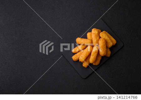 Mozzarella cheese sticks, breaded and fried with salt and tomato sauce, for takeaway. Cheese sticks Mozzarella cheese sticks, breaded and fried with salt and tomato sauce, for takeaway. Cheese sticks 141214766