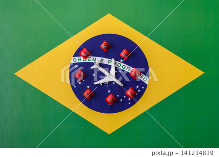 A mock up of airplane surrounded by no fly signs on a brazil flag as a concept A mock up of airplane surrounded by no fly signs on a brazil flag as a concept 141214819