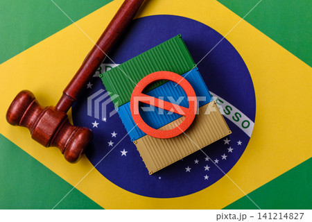 The cargo container ban on the brazil flag as a conceptual backdrop. Cargo container embargo The cargo container ban on the brazil flag as a conceptual backdrop. Cargo container embargo 141214827
