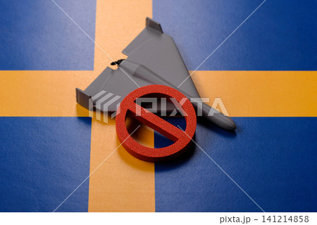 A Shahed drone featuring a prohibition symbol on the Sweden flag, conceptual background for defense A Shahed drone featuring a prohibition symbol on the Sweden flag, conceptual background for defense 141214858