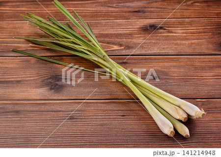Fresh lemongrass stalks on rustic wooden surface Fresh lemongrass stalks on rustic wooden surface 141214948