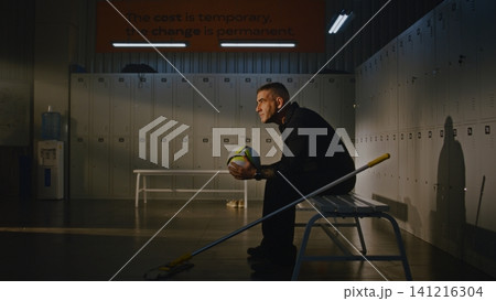 Exhausted Janitor Sitting on Bench with Soccer Ball Nostalgic About Youth Exhausted Janitor Sitting on Bench with Soccer Ball Nostalgic About Youth 141216304