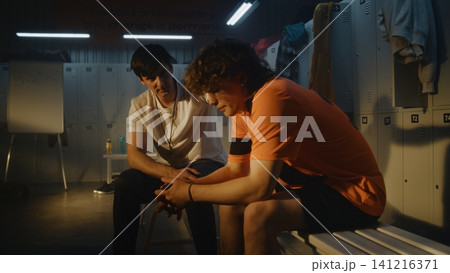 In Silence of Empty Football Locker Room, Coach Helps Young Player Process Disappointment after Game In Silence of Empty Football Locker Room, Coach Helps Young Player Process Disappointment after Game 141216371