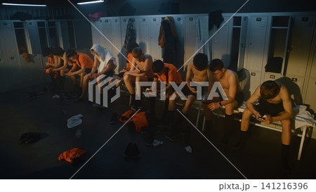 Youth Players Relaxing in Locker Room after Intense Training Session 141216396